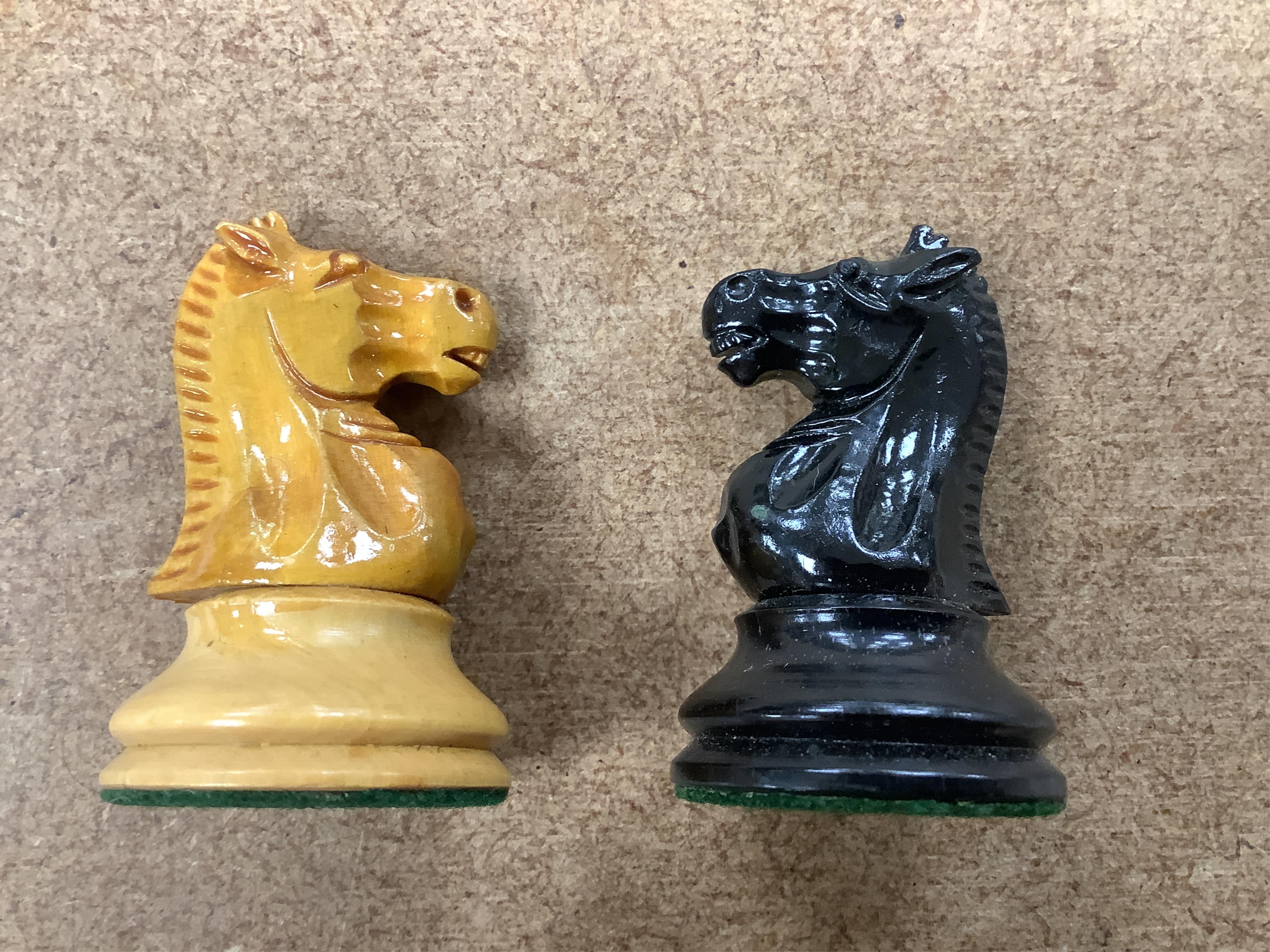 A turned wood and weighted Staunton pattern chess set, king 8cm tall. Condition - good and complete.